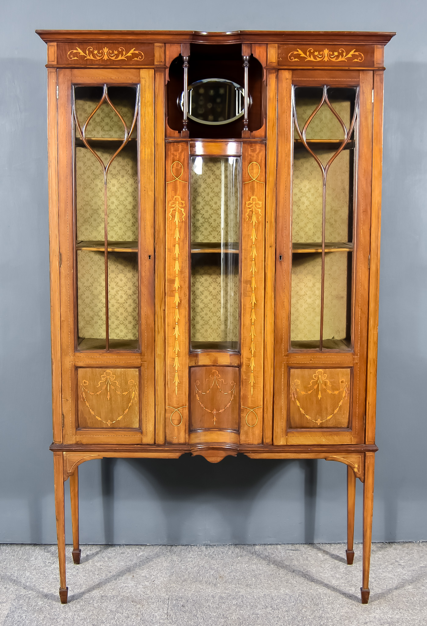 An Edwardian Mahogany and Inlaid Display Cabinet, with moulded edge to top, frieze inlaid with