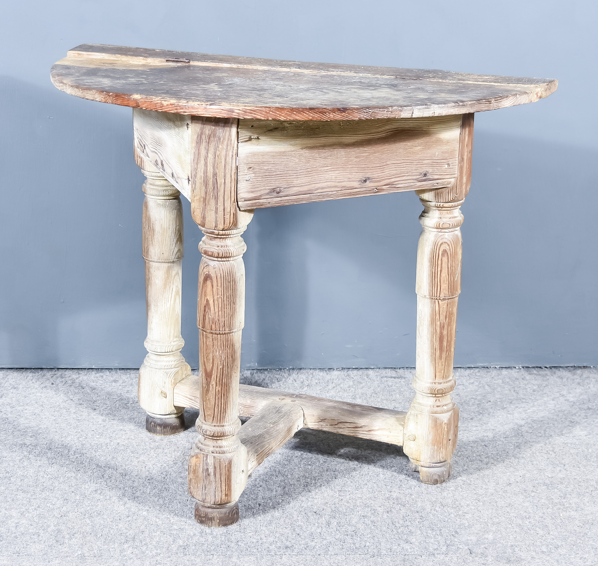 A 19th Century Pitch Pine Semi-Circular Side Table, on three turned legs and plain stretchers, 39ins