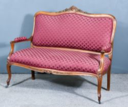 An Early 20th Century Beech Wood Settee of Louis XV Design, the shaped and moulded frame with scroll