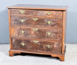 An 18th Century Figured Walnut Chest of Drawers, with moulded edge and cross banding to the