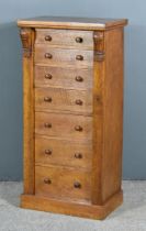 A Victorian Oak Wellington Chest, with moulded edge to top, fitted seven graduated drawers, enclosed