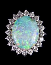 A 18ct White Gold Opal and Diamond Ring, set with a centre opal, 14mm x 12mm, surrounded by