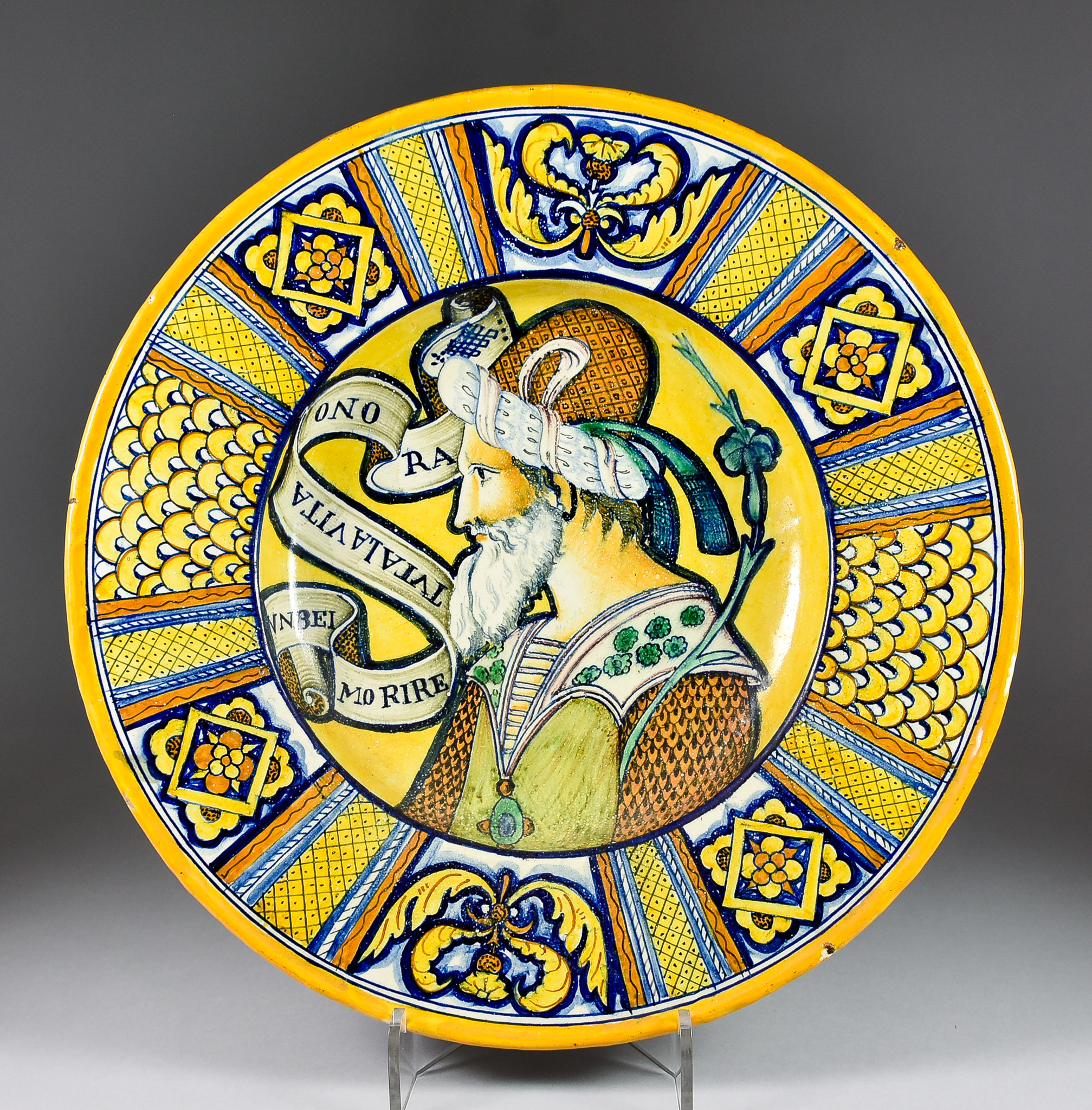 An Italian Maiolica Dish in the Deruta Style, Late 19th Century, the centre painted with the head of