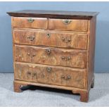 An 18th Century Walnut and Pine Sided Chest, pine top with moulded edge, the front inlaid with cross