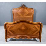 A Late 19th Century French Walnut and Kingwood 4ft 6ins Bedstead, the head board with leaf scroll