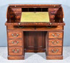 A George III Mahogany Roll Top Desk with square edge and cross-banding to top, the roll-top