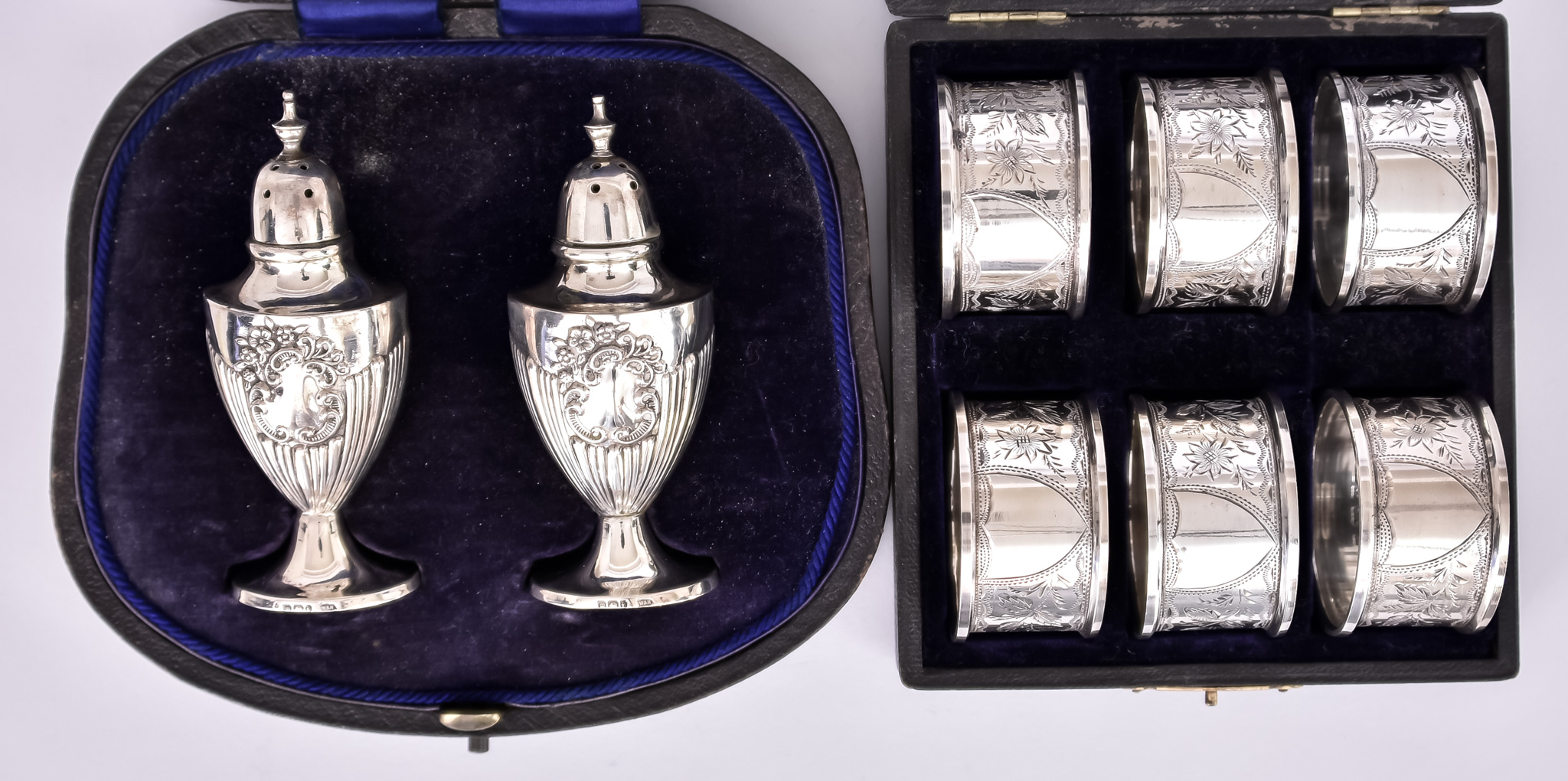 A Set of Six Edward VII Silver Napkin Rings and a Pair of Pepper Pots, the napkin rings by