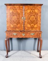 A William and Mary Laburnum Oysterwood Veneered Cabinet, the whole veneered in segmented circular,