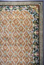 A 20th Century Indian Carpet of Aubusson Design, woven in colours of pale blue, rose and fawn, the