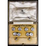 An 18ct Gold Set of Gentleman's Evening Studs, set with mother of pearl disc and small white