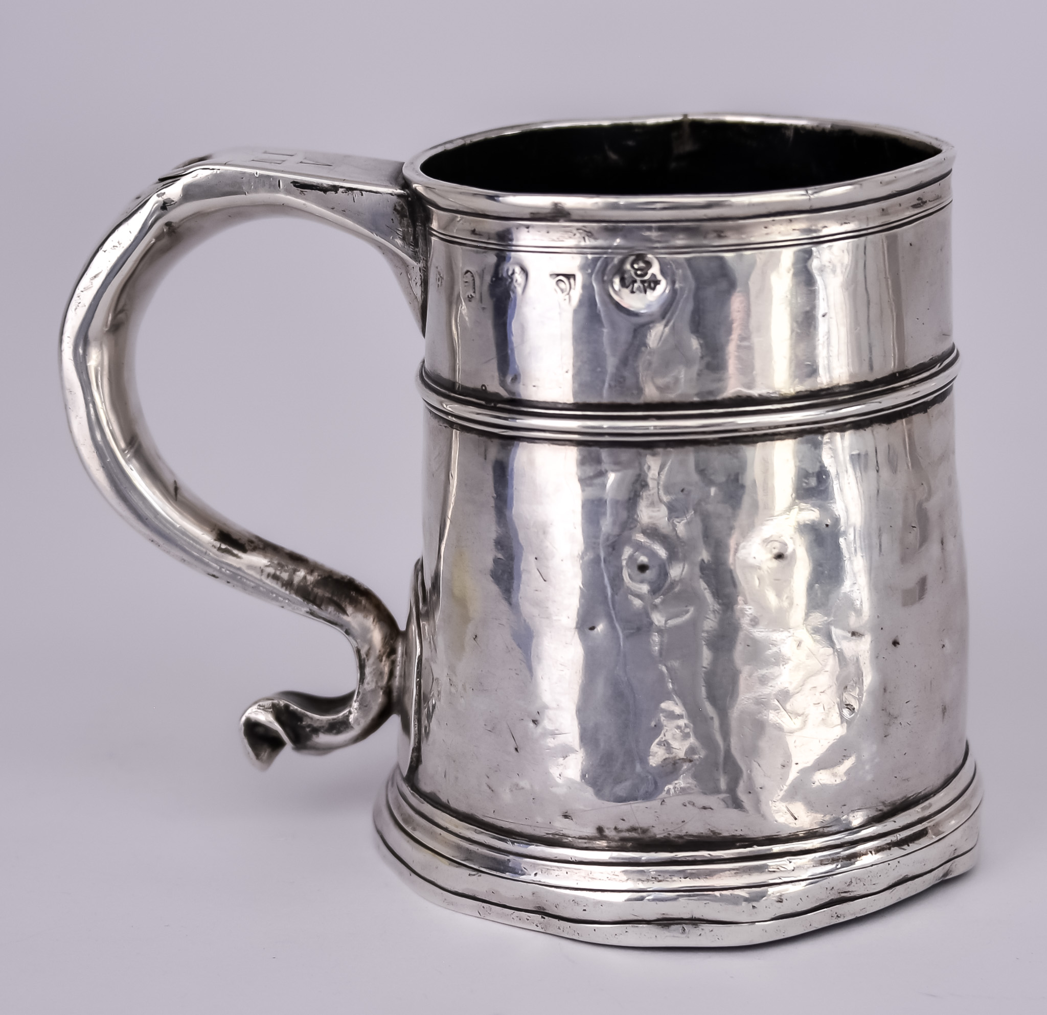 A George I Silver Tankard, possibly by Thomas Spackman, London 1715, with moulded rim, girdle and