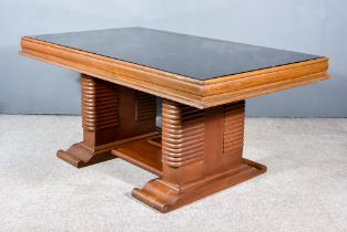 An Early 20th Century Stained Walnut Table of Art Deco Design, with black smokey glass inset and