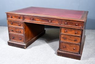 A Victorian Mahogany Partners Desk, with maroon leather and gilt tooled inset and moulded edge to