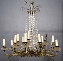 A Late 19th/Early 20th Century French Gilt Brass Eighteen Light Electrolier, mounted with glass