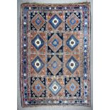 A 20th Century Yalameh Carpet woven in colours of fawn, pale blue and terracotta, with twelve hooked
