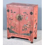 A Chinese Red Lacquer Dwarf Cabinet, 20th Century, the whole painted with birds and flowering