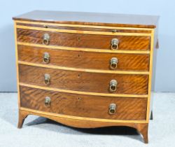 A George III Mahogany Bow Fronted Chest, the front inlaid with satinwood, fitted slide and four long