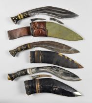 Three 20th Century Kukri Knives, various The kukri with two brass band to hilt - blade length is