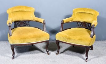 A Pair of Victorian Tub Shaped Armchairs, each with leaf and shell carved fretted splats, the back