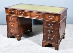 An Early 20th Century Mahogany Kneehole Desk, of "Georgian" Design, with green leather and gilt