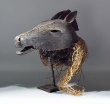 A Chokwe Wooden Dance Mask Carved as a Horse, with articulated mouth, 20th Century, 17ins wide, with
