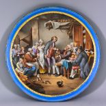 A French Porcelain Circular Plaque, 19th Century, enamelled in colours with an interior cottage