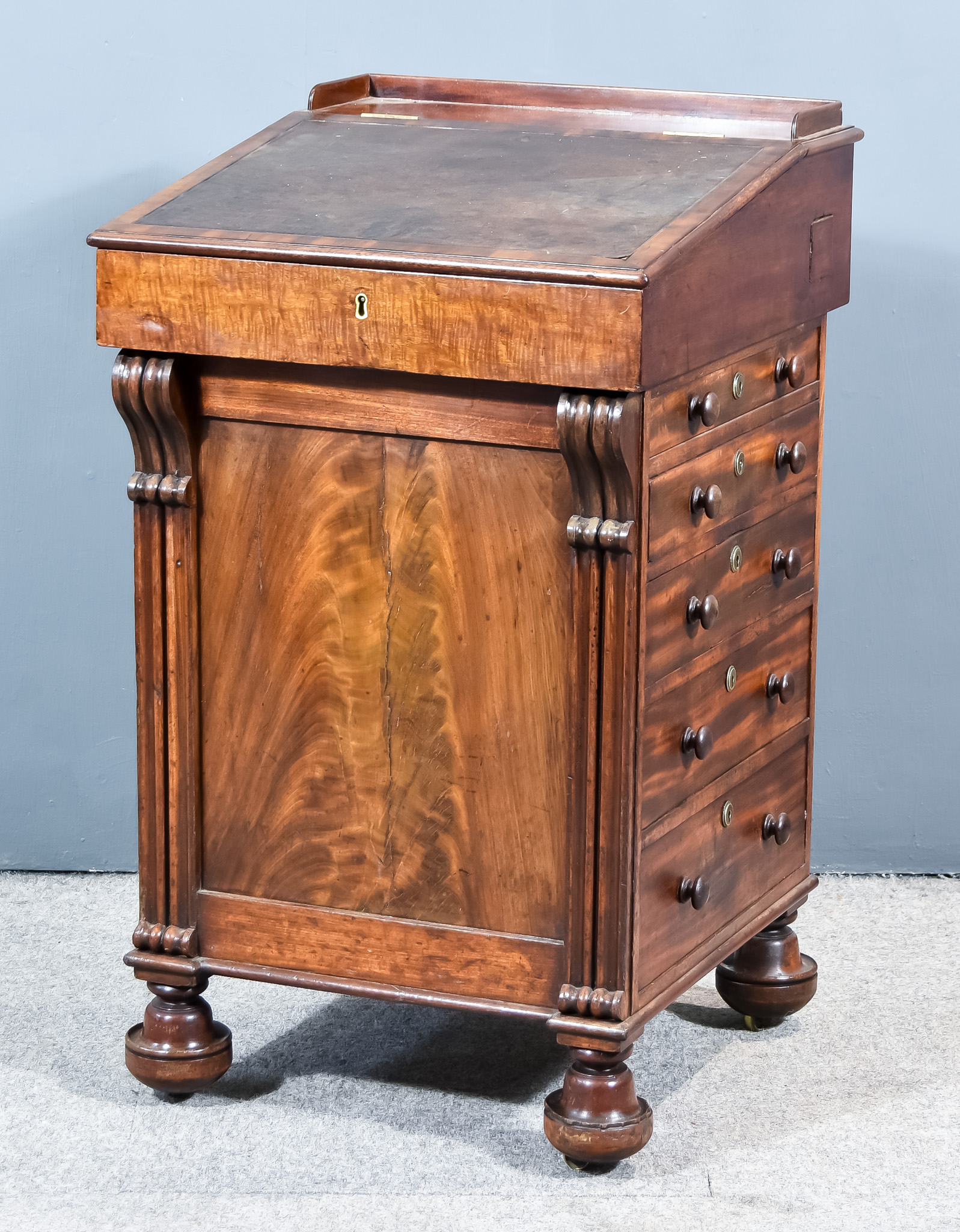 A George IV Mahogany Davenport, with tray, leather lining and moulded edge to top, enclosing four