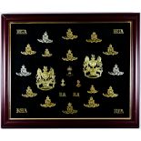 A Framed Collection of Cap Badges and Helmet Plates for the Royal Artillery Note: Photographic