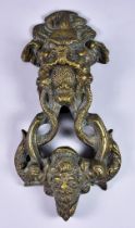 An Italian Bronze Door Knocker, 19th Century, after a 17th century model, cast with a bearded head