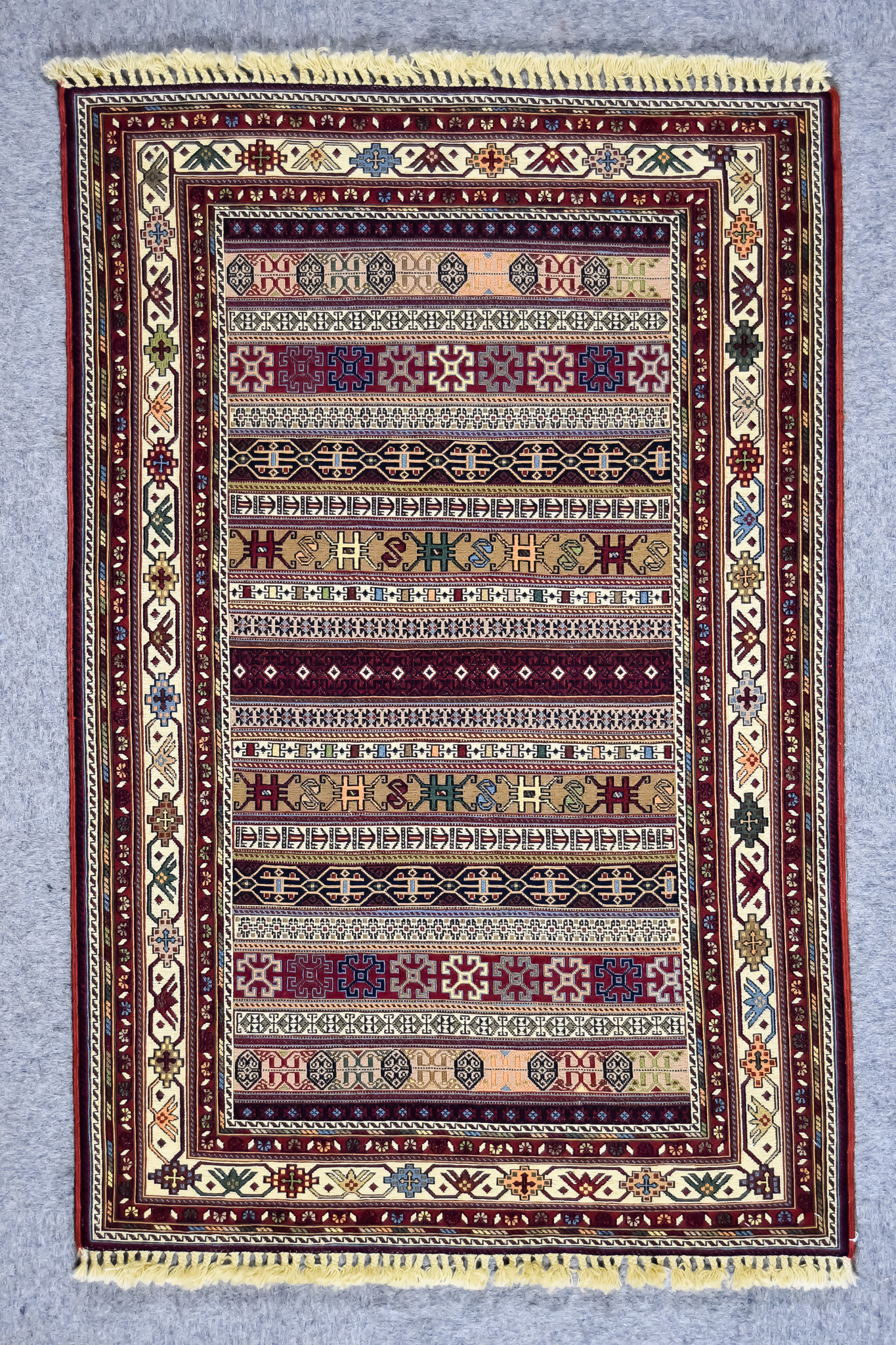 A 20th Century Kerman (Sirjan - Afshar) Rug, woven in colours of fawn, ivory, navy blue, and wine,