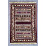 A 20th Century Kerman (Sirjan - Afshar) Rug, woven in colours of fawn, ivory, navy blue, and wine,