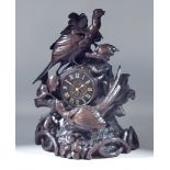A Late 19th Century Black Forest Carved Wood Cased Mantel Clock No.734, the 4.5ins chapter ring with