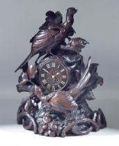 A Late 19th Century Black Forest Carved Wood Cased Mantel Clock No.734, the 4.5ins chapter ring with