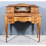 An Edwardian Inlaid Rosewood Writing Table, the superstructure with four drawers, the base fitted