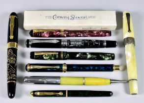 A Collection of Writing Implements, comprising - a 1930's Montegrappe celluloid fountain pen,