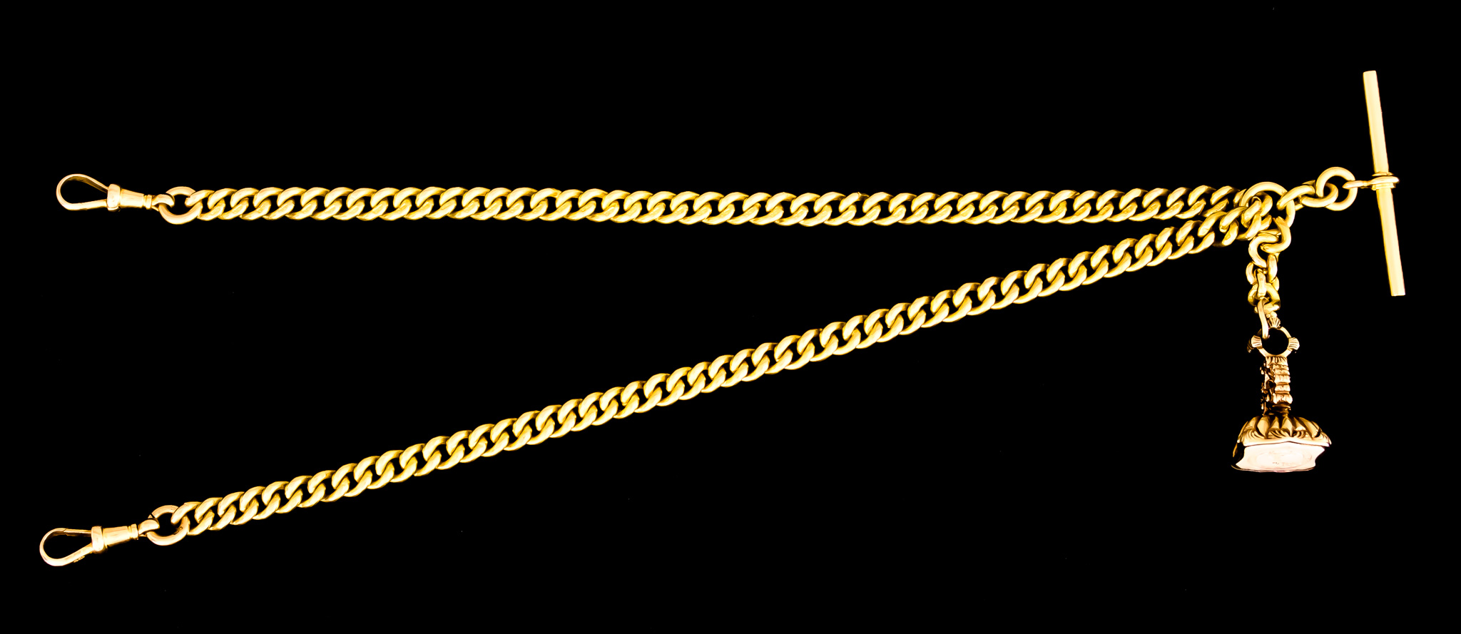An 18ct Gold Double Albert Chain, with suspended metal fob, 420mm overall, with an 18ct gold T-