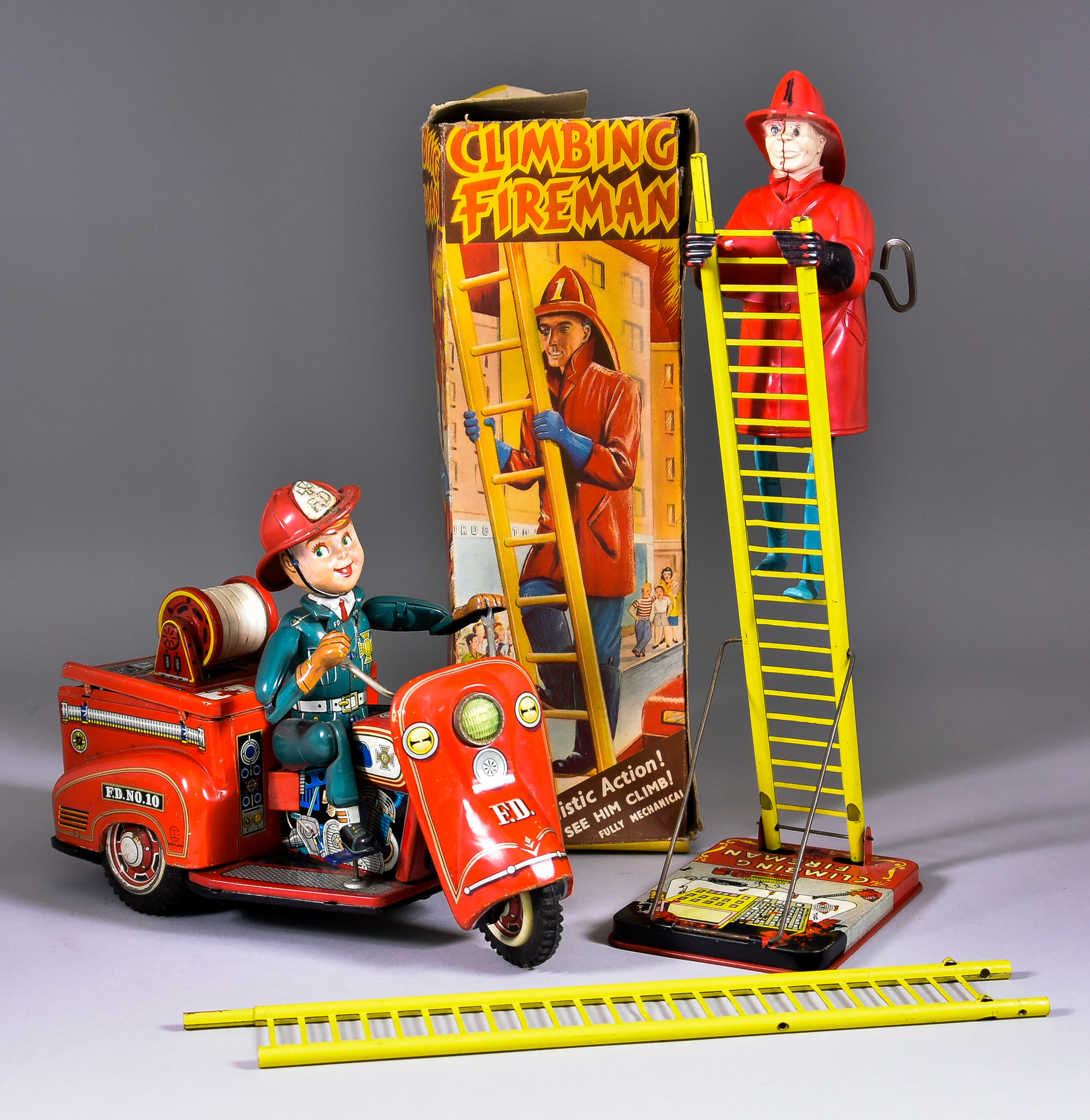A Japanese Tin Plate Battery Operated Fire Tricycle, possibly Nomura, and a Louis Marx & Co.