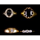 Four 18ct Gold Gem Set rings, comprising - one gentleman's set with a amethyst stone, size S+, one