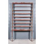 A Late 18th/Early 19th Century Painted Pine Seven Tier Rail, with shaped cresting and sides, and