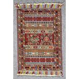 A 20th Century Kerman (Sarjan-Afshar) Rug, woven in colours of ivory, fawn, navy blue and wine, with