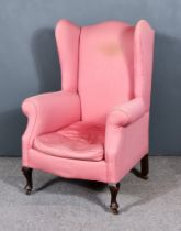 A Late 19th/ Early 20th Century Wing Back Armchair of "Georgian" Design, shaped back and out