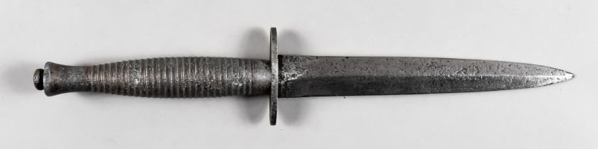 A WWII Fairbairn Sykes Fighting Knife, 6.5ins patinated bright steel blade, cast hilt (no sprew),