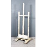 A 19th Century Cream Painted Pine Artist's Easel, on square uprights and trestle feet, 23ins x 21ins