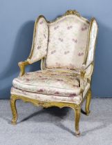 A 19th Century French Fauteuil, the gilt wood moulded frame with leaf and scroll carving, the back