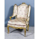 A 19th Century French Fauteuil, the gilt wood moulded frame with leaf and scroll carving, the back