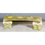 A Composition Stone Bench of Curved Form on Lion Moulded Bases, 16ins high x 54ins wide
