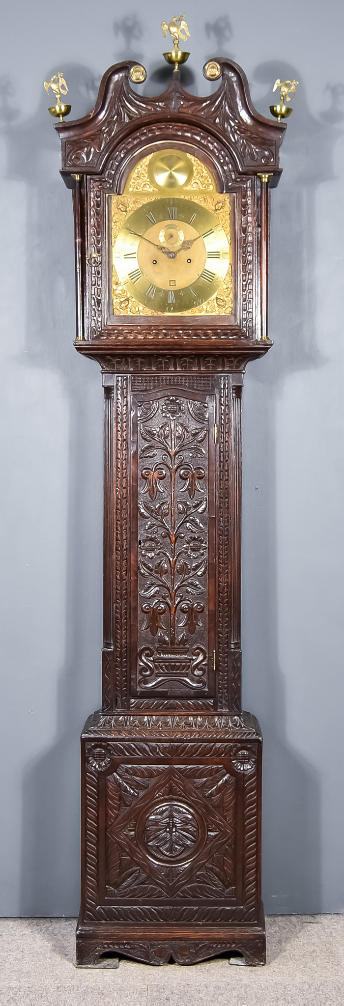 A 19th Century Oak Longcase Clock by George Hallifax of Doncaster, the 12ins arched brass dial