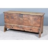 An Early 18th Century Oak Mule Chest, with single plank top, the front studded with "WM 1728",