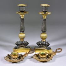 A Pair of Bronze Patinated Brass and Gilt Metal Candlesticks, of Neo Classical Form, cast with