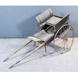 A Late Victorian Dog Cart, in painted wood, with iron wheels and rubber tyres, 62ins overall